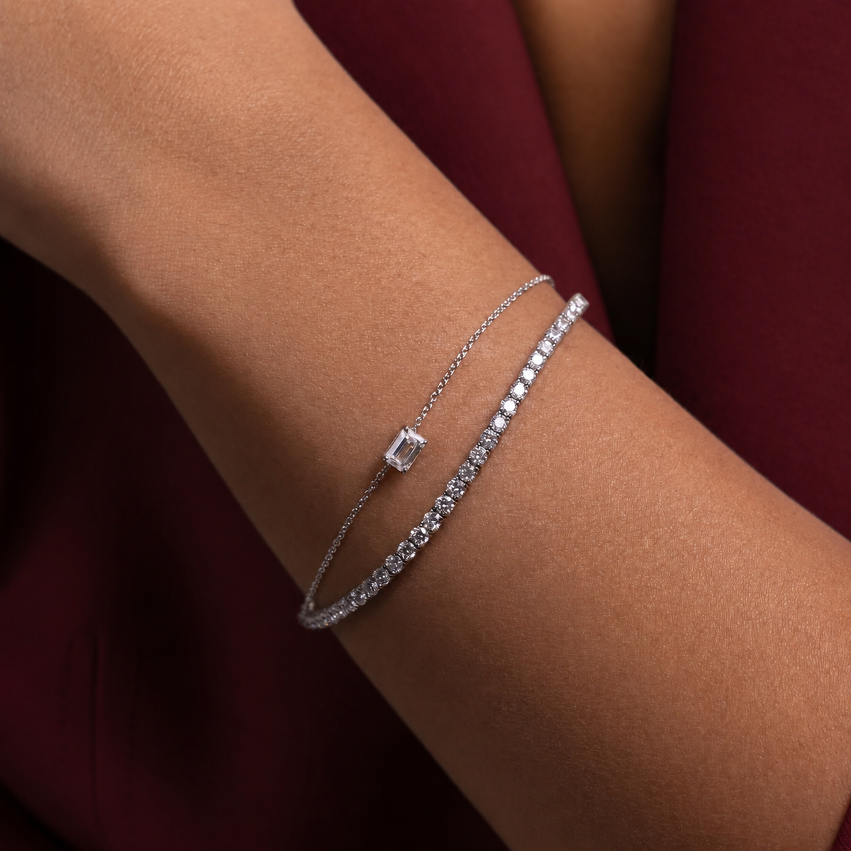 Lucent diamond tennis bracelet worn on wrist with burgundy clothing