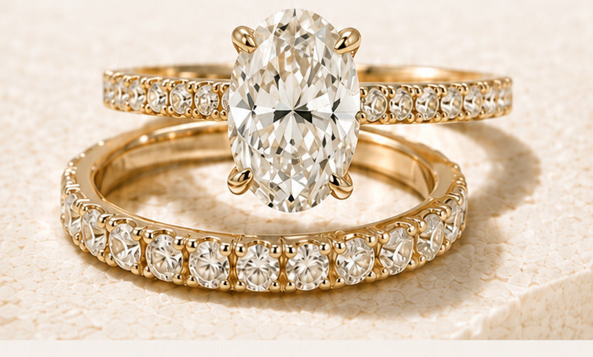 Yellow-gold oval engagement ring with a matching diamond wedding band